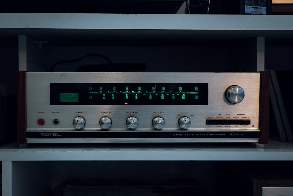 Retro Rotel stereo receiver RX-400 with classic controls and vintage appeal.